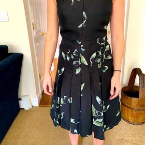 Beautiful black midi dress with green butterflies and pleated front